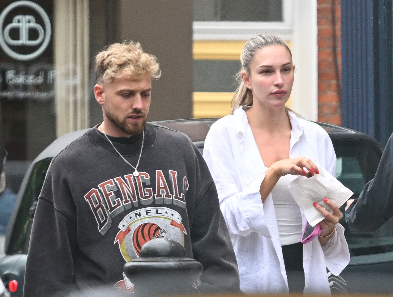 Zara looked tense as she walked with partner Sam Thompson