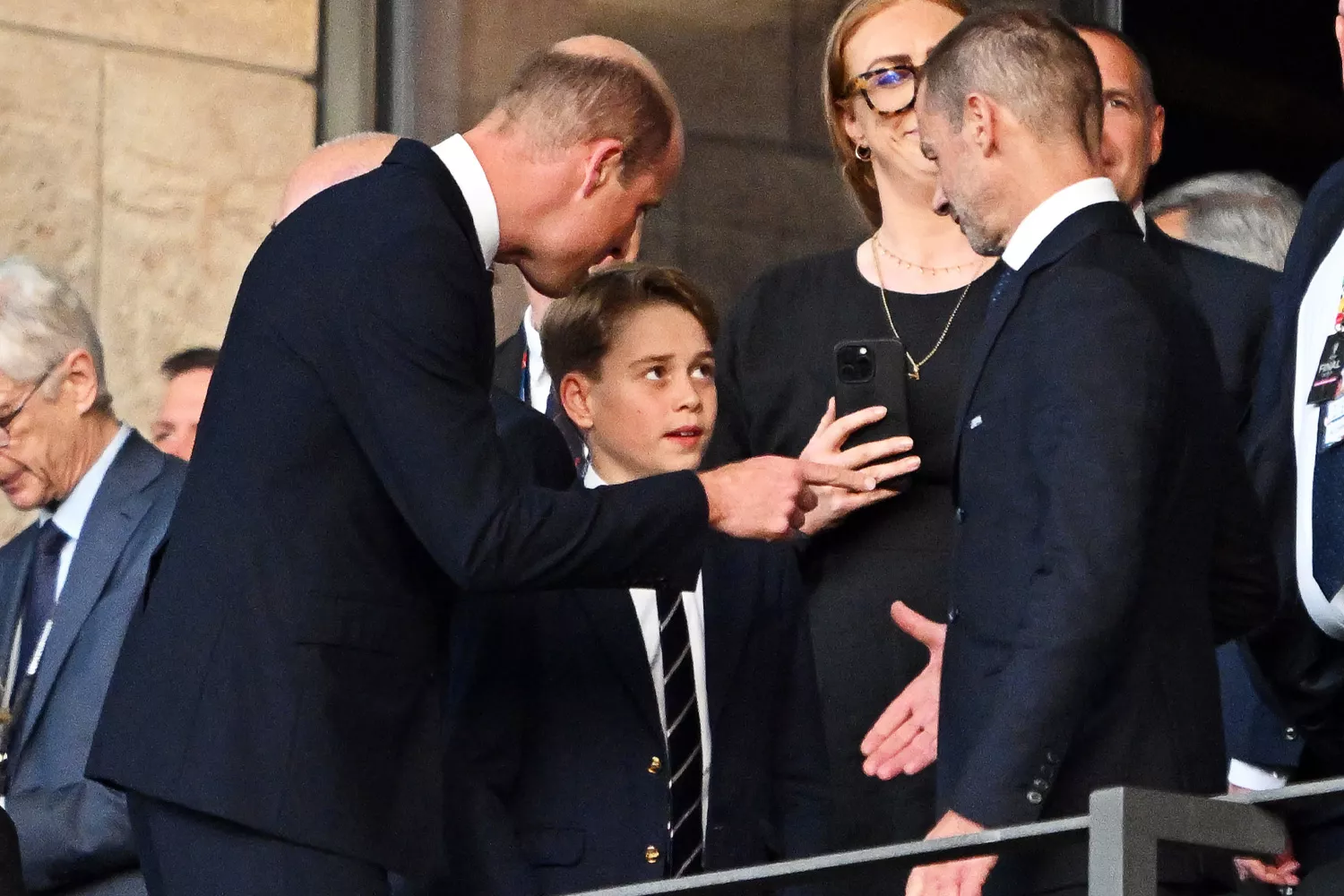 European Championship, Final, Spain - England, Olympiastadion Berlin, William (center l), Prince of Wales, introduces his son Prince George (M) to UEFA President Aleksander Ceferin (center r) in the stands before the start of the match