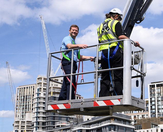 They climbed into cherry pickers and were raised high above the show's London studio (Dermot O'Leary pictured)